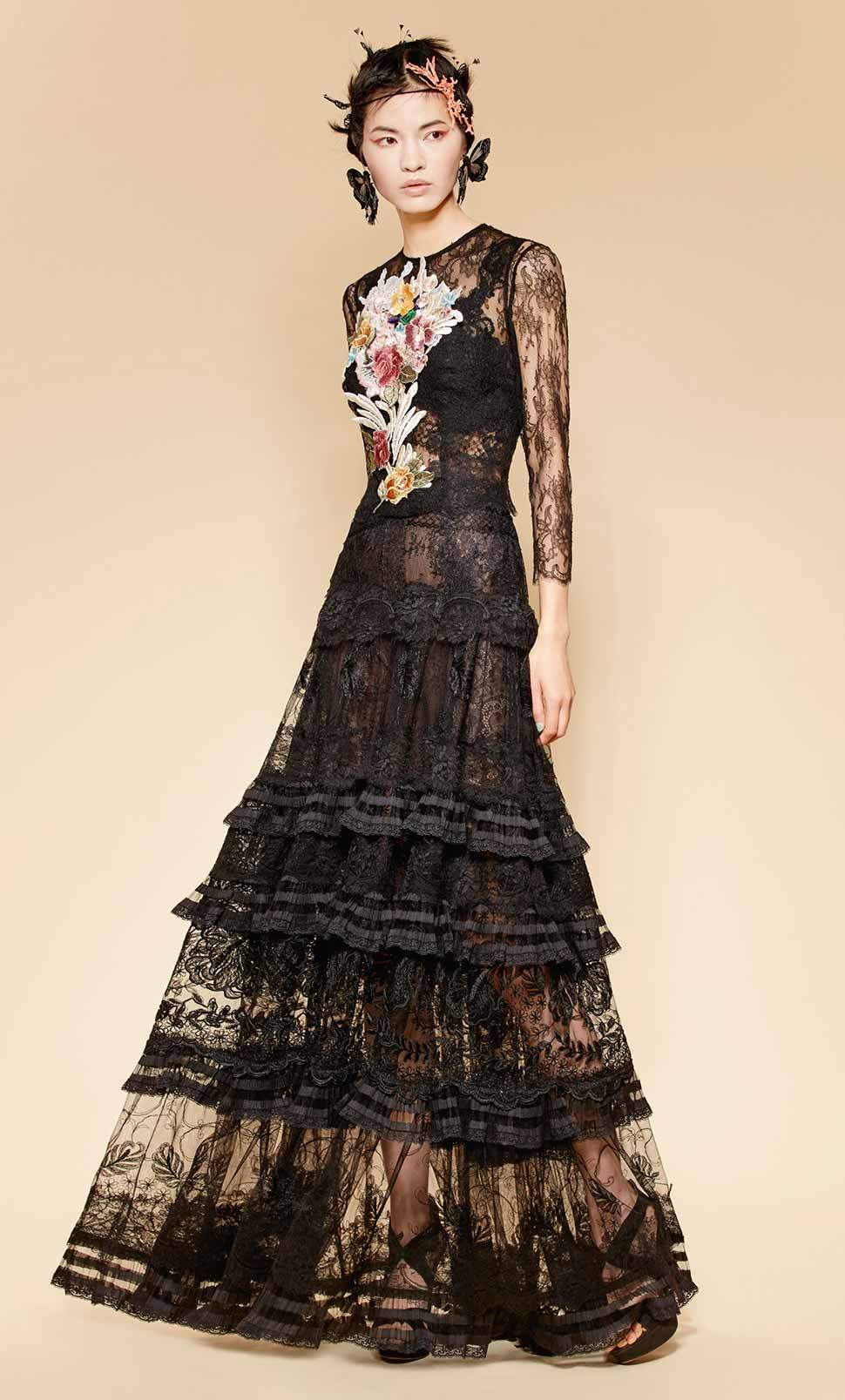 Black lace blouse with hand embroidered silk flowers in pastel shades over long black lace dress