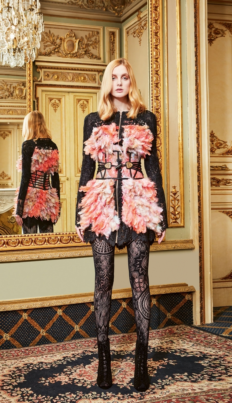 Couture coat made of pink, salmon and white natural feathers over black guipure