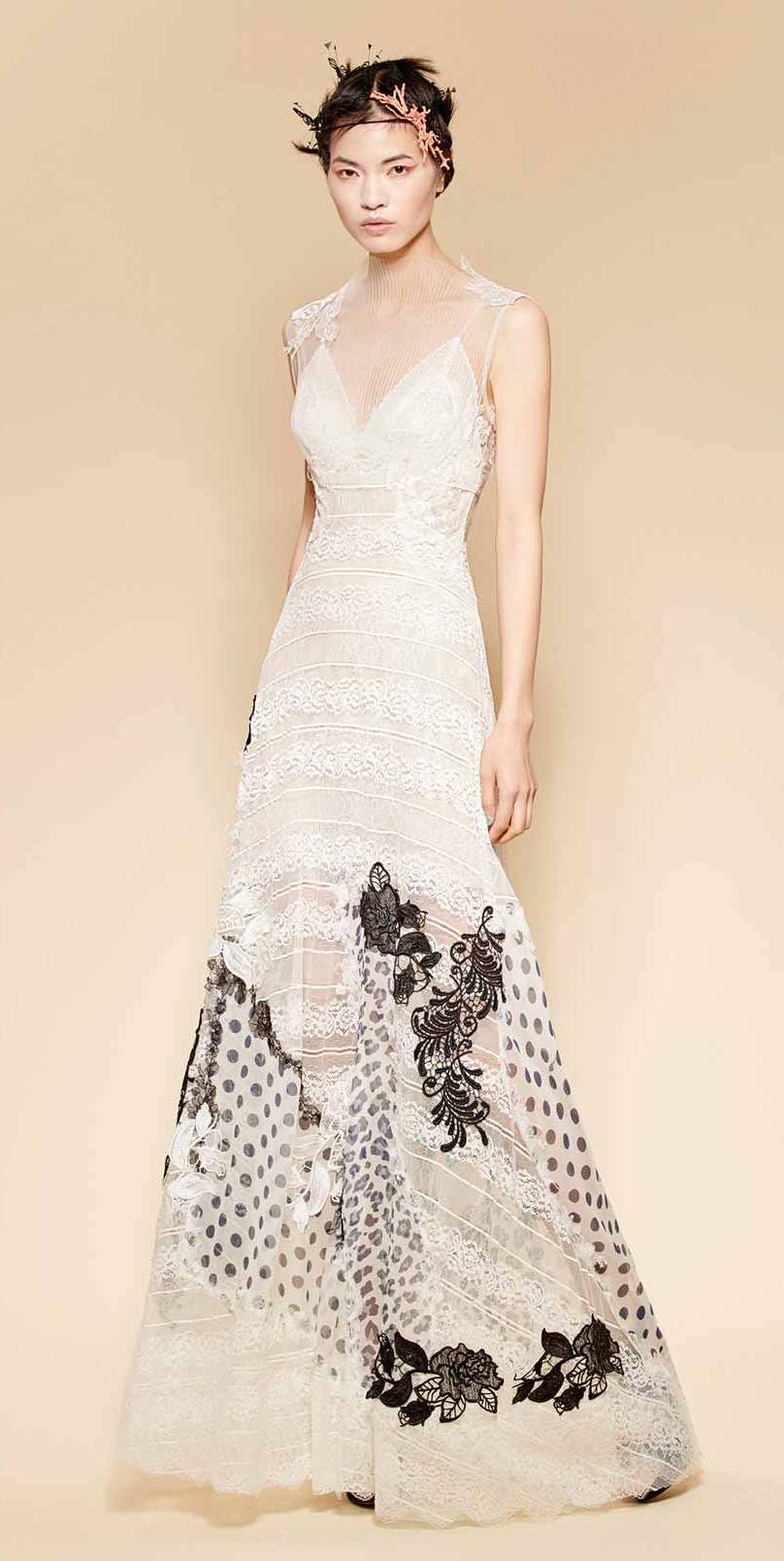 Couture white dress made of striped lace with handmade patchwork skirt made of different black and white printed silks and black silk laces
