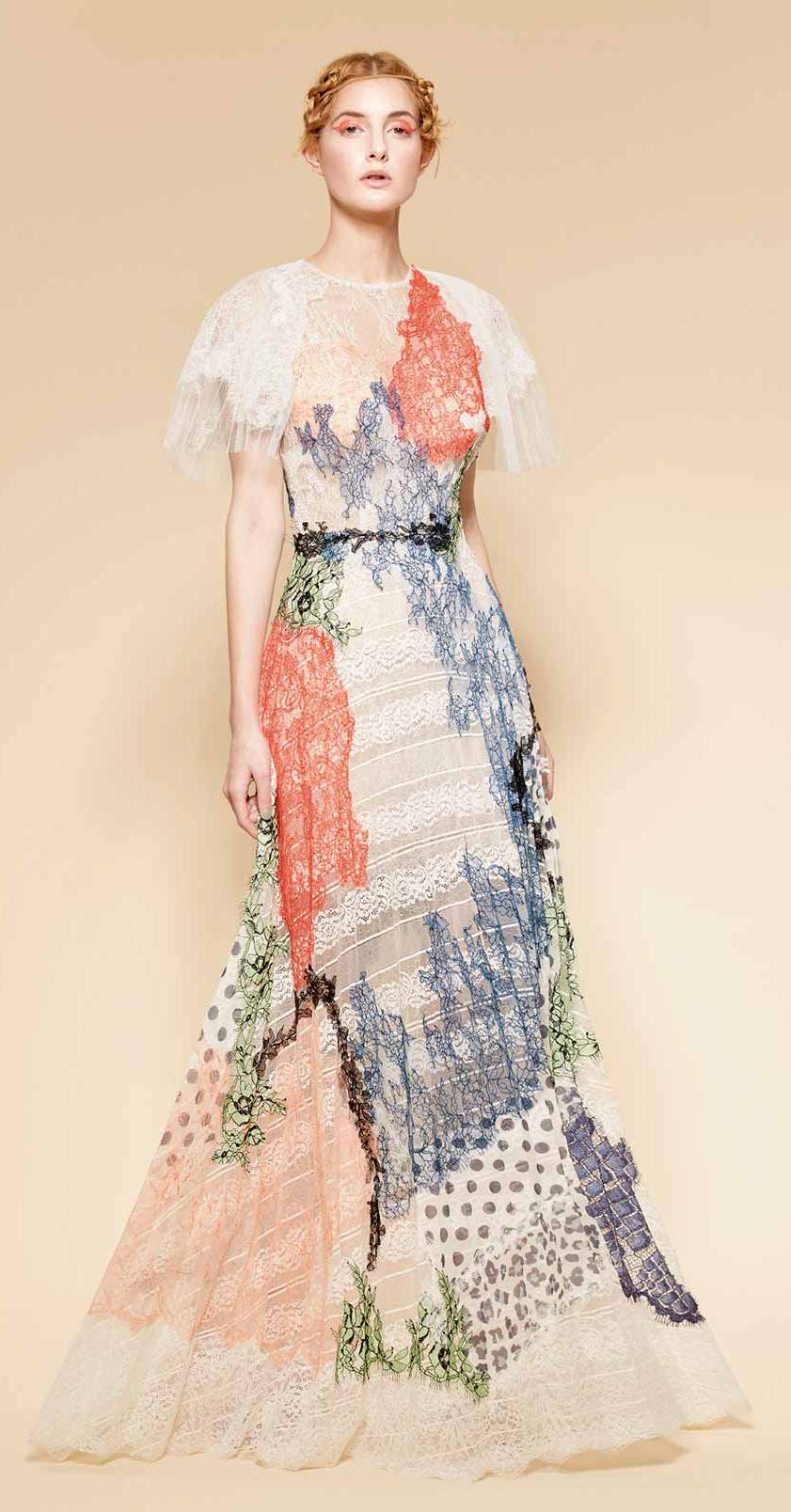 Elegant and delicate colorful gown made of different types of French lace chantilly creating a beautiful patchwork