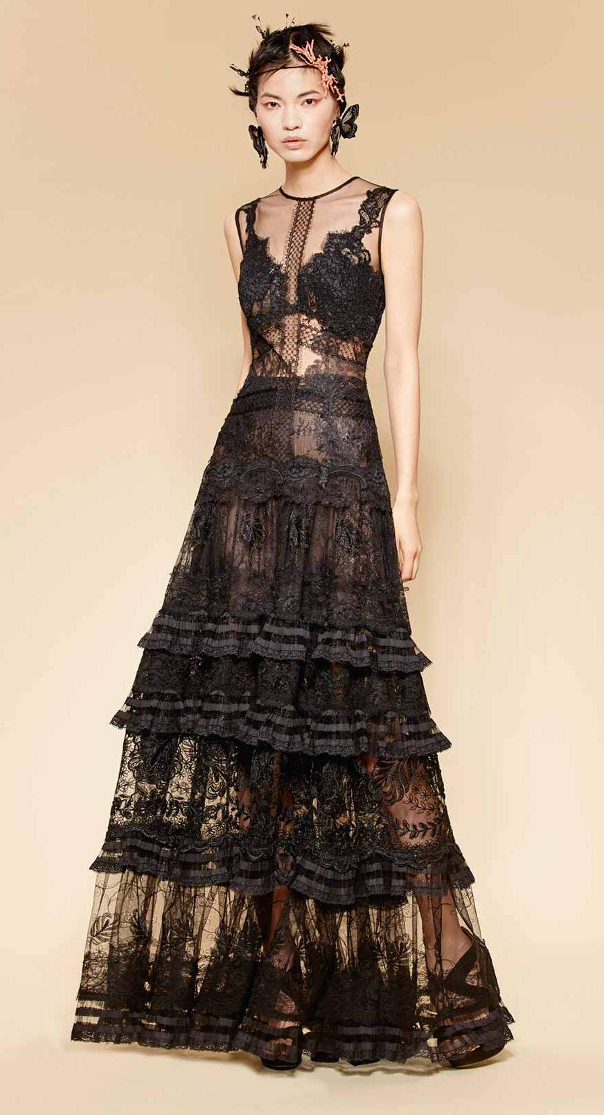 Long couture black gown made of fine French lace with boho folk lace layered