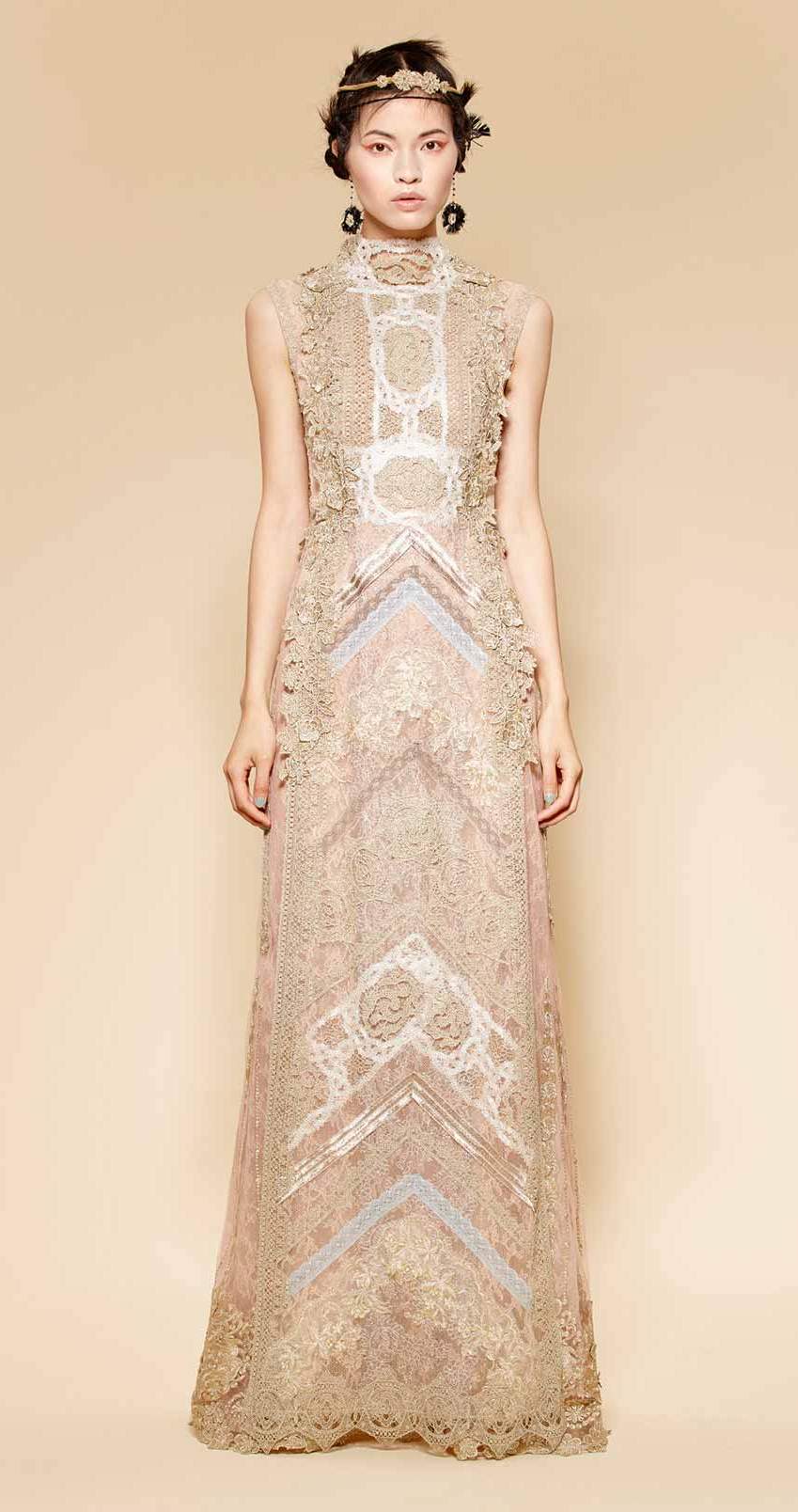 Long evening couture dress made of golden, beige and nude laces