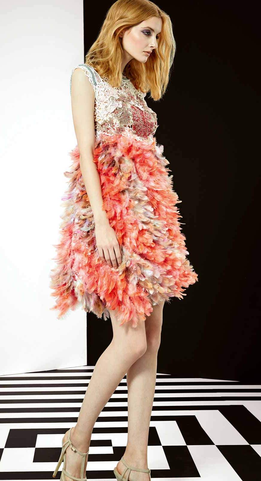 Short pink couture dress made by an overlapping silks and fine rinhestones fabrics